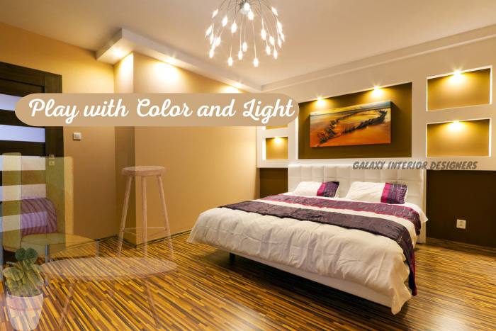 Elegant bedroom interior with warm lighting and colorful accents by Galaxy Interior Designers, enhancing Chennai living spaces.