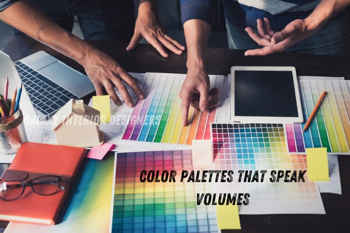 Interior design team at Galaxy Interior Designers in Chennai selecting vibrant color palettes that speak volumes for creative residential and office interiors, showcasing diverse color samples on a busy worktable