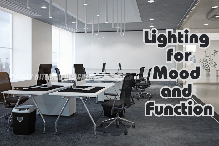 Modern office lighting for mood and function by Galaxy Interior Designers in Chennai, featuring sleek pendant lights, ergonomic desks, and an open meeting area