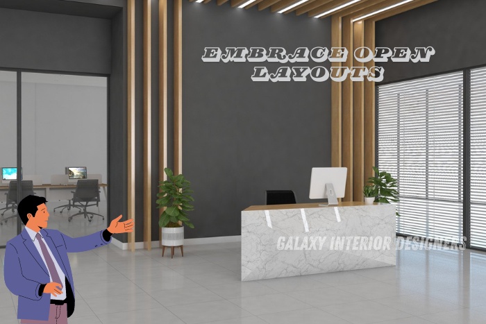 Modern office lobby featuring an open layout with a sleek reception desk, natural light, and contemporary decor by Galaxy Interior Designers, Chennai.