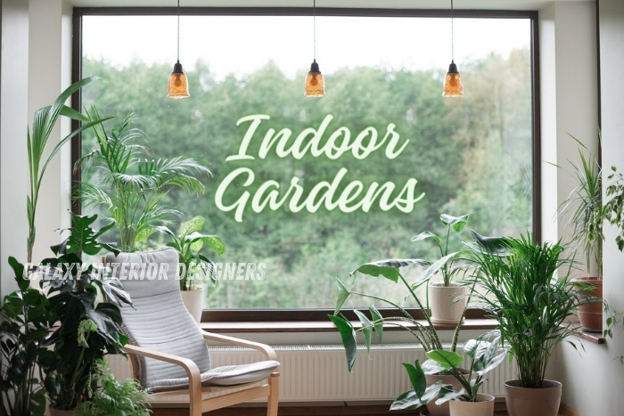 Indoor garden designed by Galaxy Interior Designers in Chennai, featuring lush potted plants, a relaxing armchair, and large windows overlooking greenery