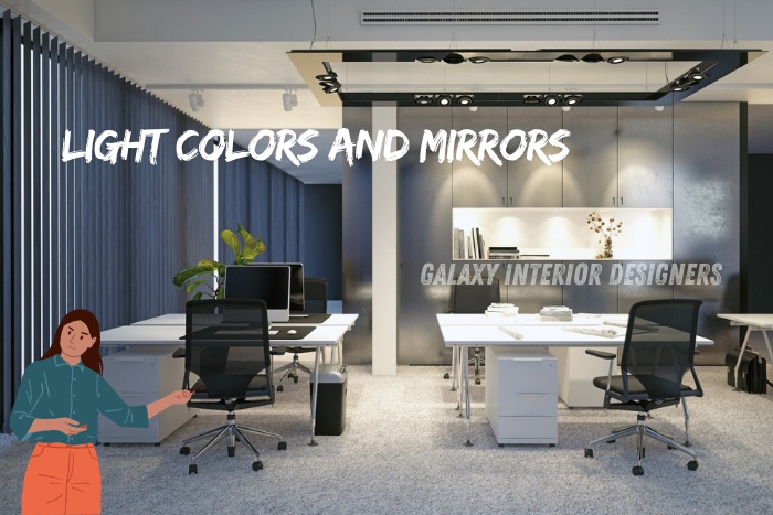 Modern office interior featuring light colors and mirrors to enhance space and brightness, designed by Galaxy Interior Designers, Chennai.