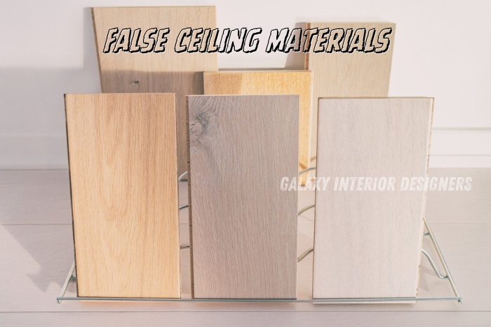 Samples of false ceiling materials offered by Galaxy Interior Designers in Chennai, showcasing various wood grain finishes to suit modern interior design needs.