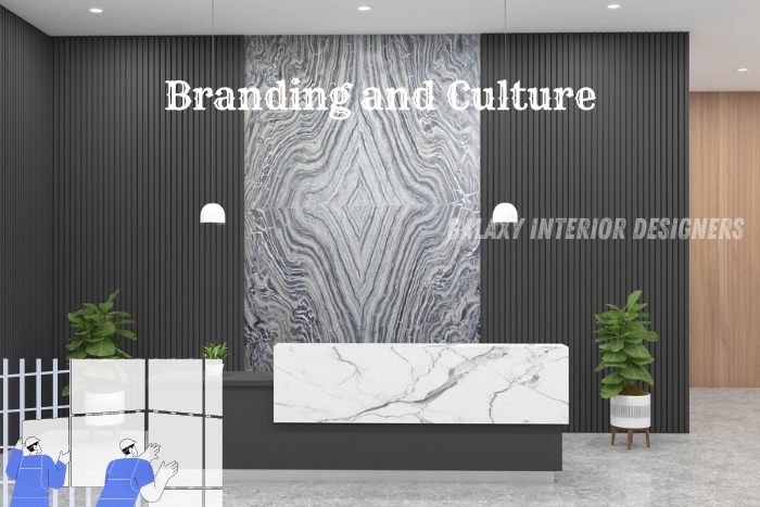 Modern office lobby highlighting branding and culture with a stylish marble reception desk and contemporary decor, designed by Galaxy Interior Designers, Chennai