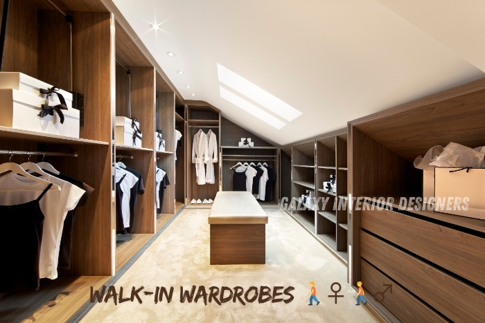 Luxurious walk-in wardrobe with wooden shelves, drawers, and ample hanging space, designed for modern Chennai homes. Upgrade your storage with Galaxy Interior Designers' stylish and functional wardrobe solutions