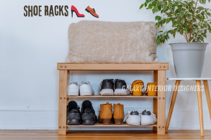 Wooden shoe rack with a cushioned seat, holding various types of shoes neatly arranged. Perfect for keeping your Chennai home organized and stylish. Discover practical storage solutions with Galaxy Interior Designers