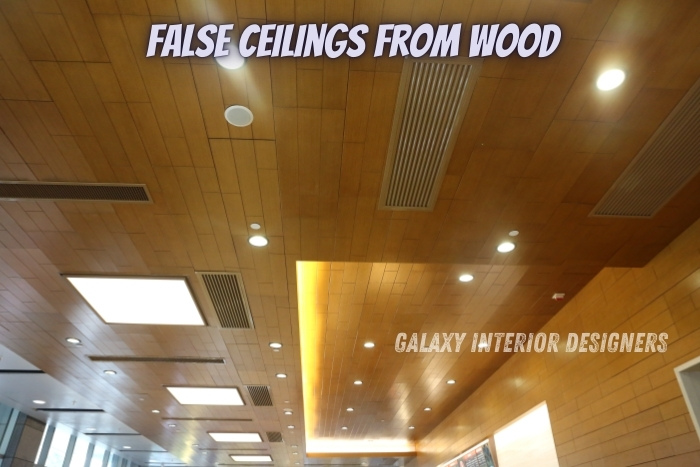 Wooden false ceiling design by Galaxy Interior Designers in Chennai, featuring warm, natural wood panels with integrated lighting for residential and commercial interiors. Specializing in custom false ceilings that add elegance and functionality to any space