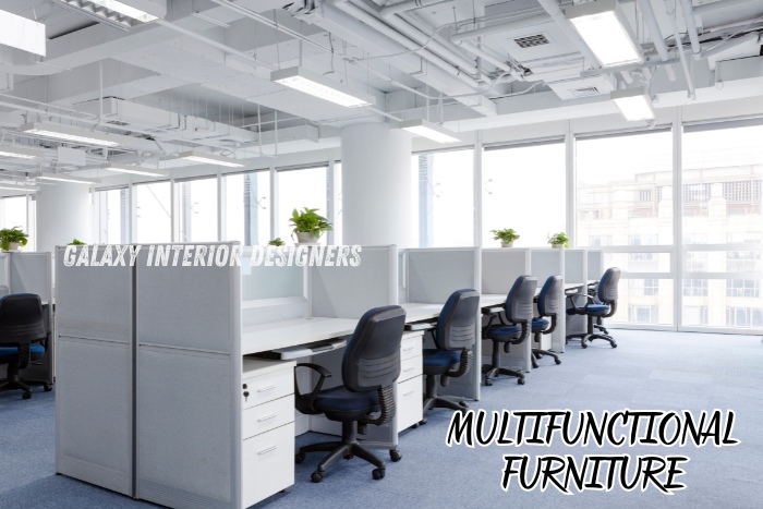 Multifunctional office furniture designed by Galaxy Interior Designers in Chennai, featuring ergonomic workstations in a modern, open-plan office. Specializing in office interiors that maximize space and enhance productivity with smart, functional furniture solutions